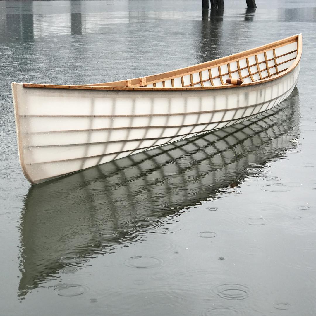 skin on frame canoe on the water