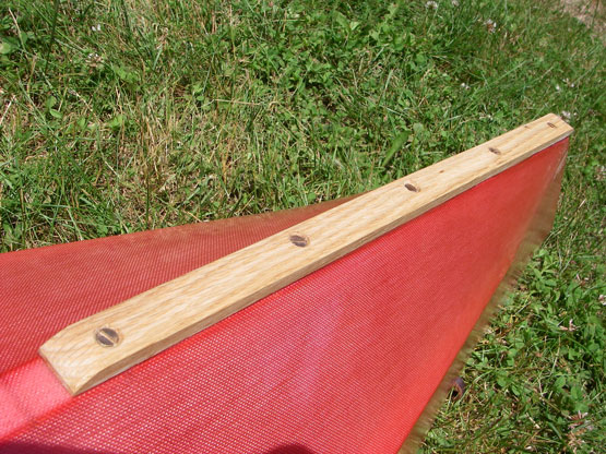 wooden rub strip on skin on frame kayak